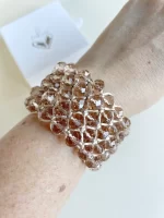 Brazalete tejido con cristales en tono nude