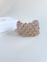 Brazalete tejido con cristales en tono nude - Imagen 2