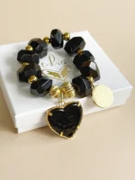 Pulsera maxi ónix corazón y Padre Nuestro